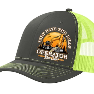May include: A gray and neon green trucker hat with a yellow excavator graphic and the text "Dirt Pays The Bills Operator Skilled Blue Collar Labor".