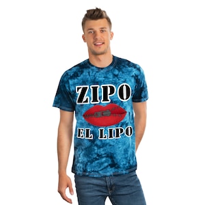 May include: A blue tie-dye t-shirt with the text "ZIPO EL LIPO" and a red mouth with a zipper in it.