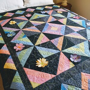 Rainbow and black geometric quilt, wall quilt with 3-D flowers, unique gift quilt, star quilt with rainbow blossoms, quilt for sale