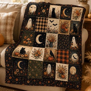 May include: A patchwork quilt featuring a repeating grid of Halloween-themed squares. The design includes illustrations of black cats, ghosts, crescent moons, bats, pumpkins, floral arrangements, and black and orange plaid patterns on a dark background.