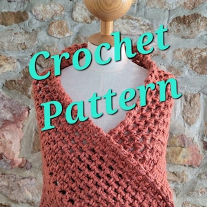 May include: A coral-colored crochet wrap displayed on a mannequin. The wrap features a V-neck design and a textured stitch pattern. The words "Crochet Pattern" are superimposed on the image in a teal font.