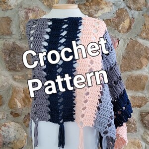 May include: A crochet shawl with a multi-colored striped pattern in shades of gray, blue, and pink. The shawl has a lacy design and fringe along the bottom edge. The text "Crochet Pattern" is superimposed on the image.
