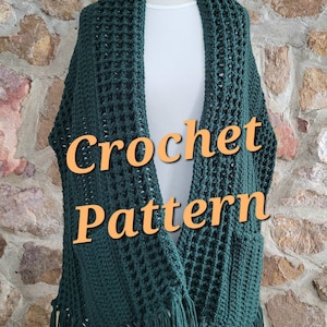 May include: A dark green crochet shawl with a fringe border. The shawl is draped over a white mannequin. The text "Crochet Pattern" is superimposed on the image.