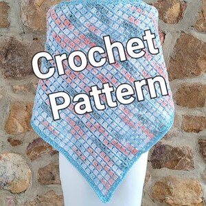 May include: A crochet pattern for a triangular shawl in shades of blue, pink, and white. The text "Crochet Pattern" is superimposed on the image.