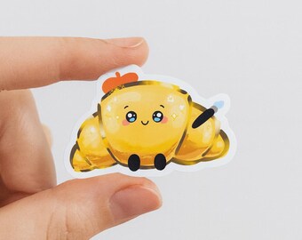 Kawaii konstnärscroissantklistermärke