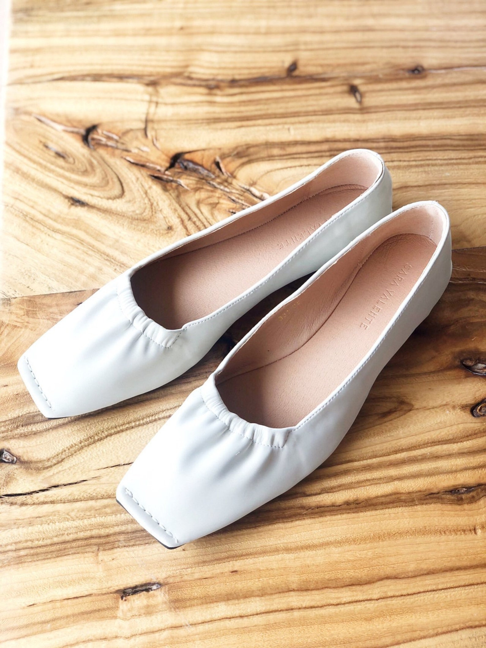 white leather flats womens