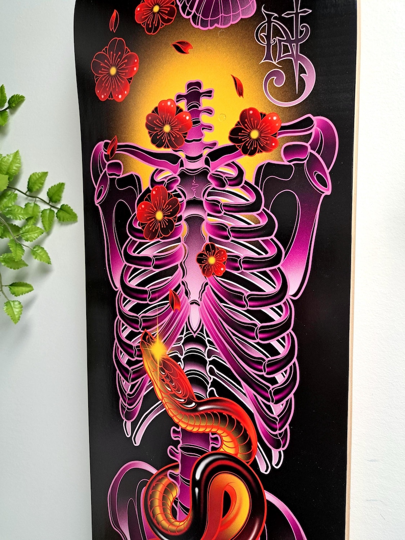 May include: A black and purple ribcage with a red snake wrapped around it. Pink flowers are falling from the top of the image.