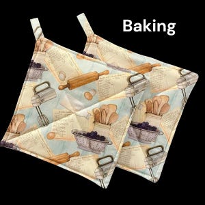 May include: Two quilted pot holders with a light blue background and a pattern of kitchen tools, recipes, and berries. The text "Baking" is printed in black at the top of the image.