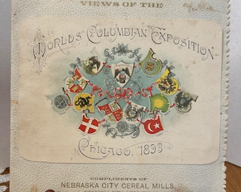 May include: An antique postcard with the text "Views of the World's Columbian Exposition Chicago, 1893." The postcard features a central design of flags and emblems. The bottom of the card reads "Compliments of Nebraska City Cereal Mills, Nebraska City, Nebraska."