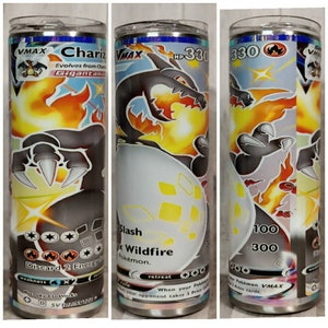 May include: A Pokemon trading card featuring Charizard VMAX with a black and orange design. The card has a HP of 330 and has attacks called Slash and Wildfire. The card is part of the Sword and Shield series.
