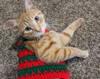 Suéter feo de gato navideño