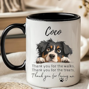 May include: A white ceramic mug with a black handle and interior rim. The mug features a graphic of a tricolor dog with the name Coco printed above it. Below the dog, the text reads: Thank you for the walks, Thank you for the treats, Thank you for loving me.