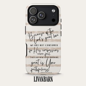 May include: A white phone case with a beige horizontal stripe design. The case features a black camera module and text that reads "Because of the Lord's great love...great is Your faithfulness." The brand name "LIVANBARN" is at the bottom.