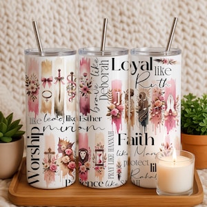 May include: Three white stainless steel tumblers with floral and inspirational designs. Each tumbler features a silver straw and text such as "Worship", "brave like Deborah", and "Loyal like Ruth". The designs include pink and beige watercolor accents.