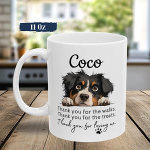 May include: A white 11 oz ceramic mug featuring a black and brown dog illustration with the name Coco printed above. Below the dog, the text reads: Thank you for the walks, Thank you for the treats, Thank you for loving me, with a paw print.