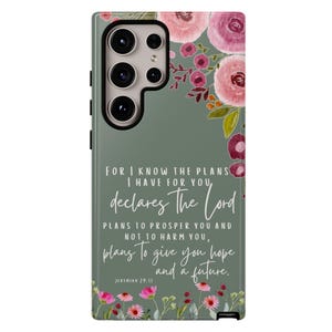May include: A phone case with a floral design and a quote from Jeremiah 29:11. The case features pink and burgundy flowers on a sage green background. The text reads, "For I know the plans I have for you, declares the Lord, plans to prosper you and not to harm you, plans to give you hope and a future."