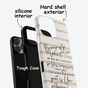 May include: A phone case with a hard shell exterior and a silicone interior. The case features a white background with vertical beige stripes and script text that reads "Because of the Lord's great love...great is Your faithfulness."