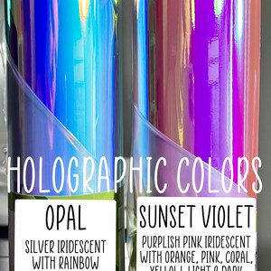 May include: Two rolls of holographic vinyl, one labeled "Opal" and the other "Sunset Violet". The Opal roll is silver iridescent with rainbow reflective colors. The Sunset Violet roll is purplish pink iridescent with orange, pink, coral, yellow, light and dark purple reflective colors.