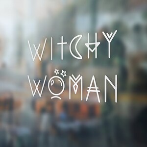 May include: White text on a blurred background that reads "Witchy Woman" with a crescent moon, a star, and a crystal symbol.