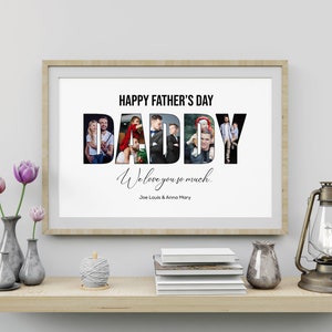 May include: A framed print with the text "HAPPY FATHER'S DAY DADDY We love you so much" with family photos inside the letters. The print is displayed on a wooden shelf with vases, books, and a lantern.