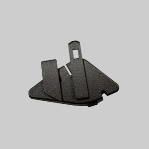 May include: A black, textured plastic component featuring an irregular, angular shape with a central vertical tab containing a rectangular cutout. The piece has a matte finish and includes a small notch on the lower right edge, designed for mechanical assembly.