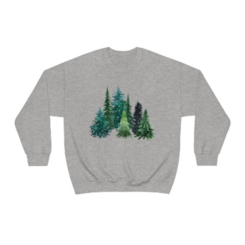May include: A gray sweatshirt with a watercolor design of a group of green pine trees.