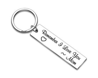 May include: Silver keychain with a heart and the text "Remember I Love You ~ Mom".
