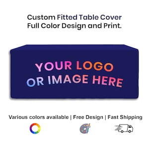 May include: A navy blue fitted table cover with the text "YOUR LOGO OR IMAGE HERE" in a rainbow gradient. The text is centred on the cover. The image also shows a colour wheel, a paint palette with a paintbrush, and a delivery truck icon.