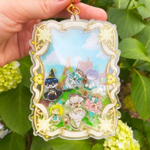 Witch Hat Atelier Shaker Keychain  4” Double-Sided Acrylic Charm with Coco, Qifrey, Olruggio, Tetia, Agott, Riche, Brush bug