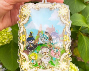 Witch Hat Atelier Shaker Keychain  4” Double-Sided Acrylic Charm with Coco, Qifrey, Olruggio, Tetia, Agott, Riche, Brush bug