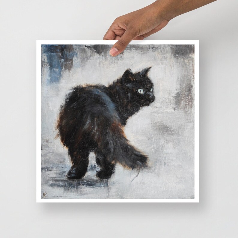 May include: A black cat with green eyes is walking away from the viewer. The cat is in focus, while the background is a blurry, light gray.