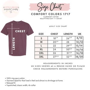 May include: A maroon Comfort Colors heavyweight t-shirt with a size chart. The chart displays chest and length measurements in inches for sizes S to 3XL. The shirt features a relaxed fit, rib collar, and is made of 100% ring-spun cotton.