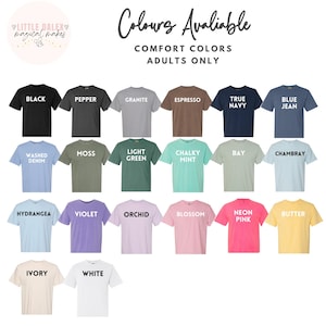 May include: A display of Comfort Colors adult t-shirts in various colors, including black, blue jean, and neon pink. The image includes the text "Colours Available" and the brand logo.