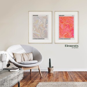 May include: Two framed abstract art prints with a swirling, marbled design. The print on the left is in shades of gray, yellow, and blue. The print on the right is in shades of pink, orange, and red. Both prints have the word "HIGHER" and "CONSCIOUSNESS" printed on them.