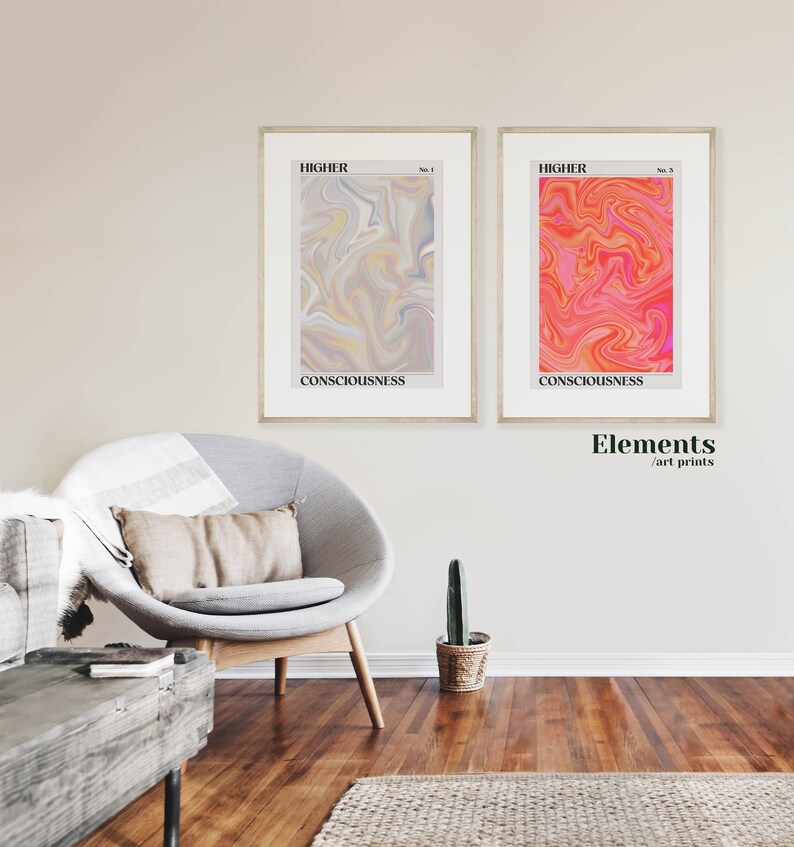 May include: Two framed abstract art prints with a swirling, marbled design. The print on the left is in shades of gray, yellow, and blue. The print on the right is in shades of pink, orange, and red. Both prints have the word "HIGHER" and "CONSCIOUSNESS" printed on them.