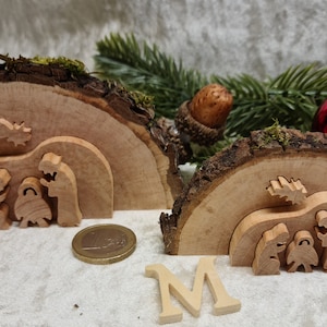 Small Christmas nativity scene in a tree disc that can be pushed out 3D