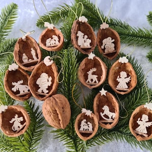 Real walnut shells with fretwork tree branch pendant