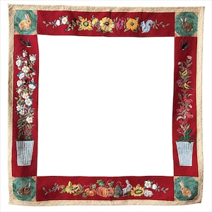 May include: A red quilt with embroidered floral and animal designs. The quilt features a square center with a border of flowers, pumpkins, squirrels, and rabbits. The border is a deep red with a cream-colored edge.
