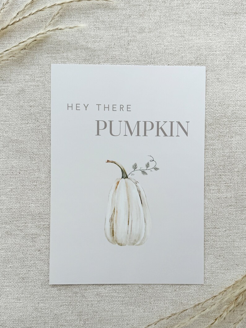 May include: White watercolor pumpkin with a green stem and leaves. The text "Hey There Pumpkin" is written in gray above the pumpkin.