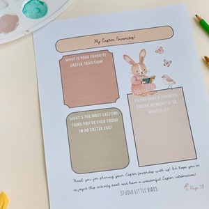 May include: A printable Easter activity sheet with the title "My Easter Favorites." The sheet features a bunny reading a book, a bird, and prompts to write about Easter traditions and memories. Colored pencils and paint are in the background.