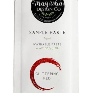 May include: A sample packet of red glitter paste, labeled "Glittering Red" and "Washable Paste 0.19 fl oz / 5.71 ml". The packet features a black and white logo for Magnolia Design Co. with the text "Made with Love".