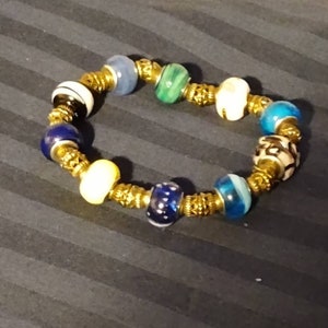 7 1/2 inch, 12mm, European, Lampwork beads, with stainless steel, cone shaped, spacer beads, on elastic cord