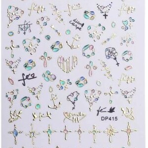 May include: Gold nail art stickers with a variety of designs, including crosses, anchors, hearts, and chains. The stickers also feature the words "fee" and "dream carpe".