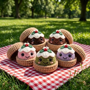 May include: Five crocheted plush toys shaped like small puddings, each nestled in a tan acorn-like shell. The puddings are brown, pink, green, purple, and dark brown, topped with white frosting, green leaves, and a small red berry, with black eyes.