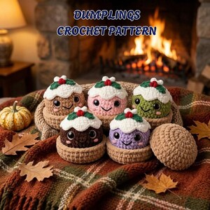 May include: Five small, round, crocheted plush toys resembling holiday puddings with white frosting tops, green leaves, and red berries. Each has large black eyes and a stitched smile. The text DUMPLINGS CROCHET PATTERN is displayed above.