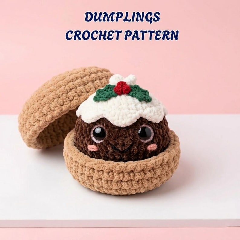 May include: A crochet pattern titled DUMPLINGS CROCHET PATTERN featuring a dark brown plush dumpling character with large black eyes, pink cheeks, and a white frosting top decorated with green leaves and red berries, nestled in a tan bowl.