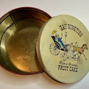 Gay Nineties Rum Brandy Fruit Cake Tin Round Bike Horse Carriage Ad Food Vintage