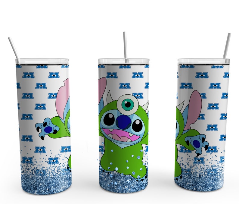 May include: A white tumbler with a blue glitter bottom. The tumbler features a cartoon character with blue fur and a green monster costume. The character has a single large eye and a small mouth. The background is a white pattern of blue eyes.