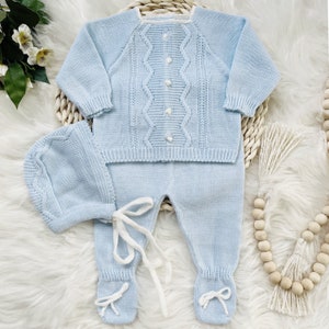 A lovely three-piece knitted set for babies with a sweater, bonnet, and pants. Suitable for baptisms, baby shower gifts, or bringing your newborn home from the hospital. It also can be purchased with a matching knitted blanket.