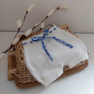 Hand-knitted baby bloomers in white merino wool, lavender Betsy Liberty fabric
